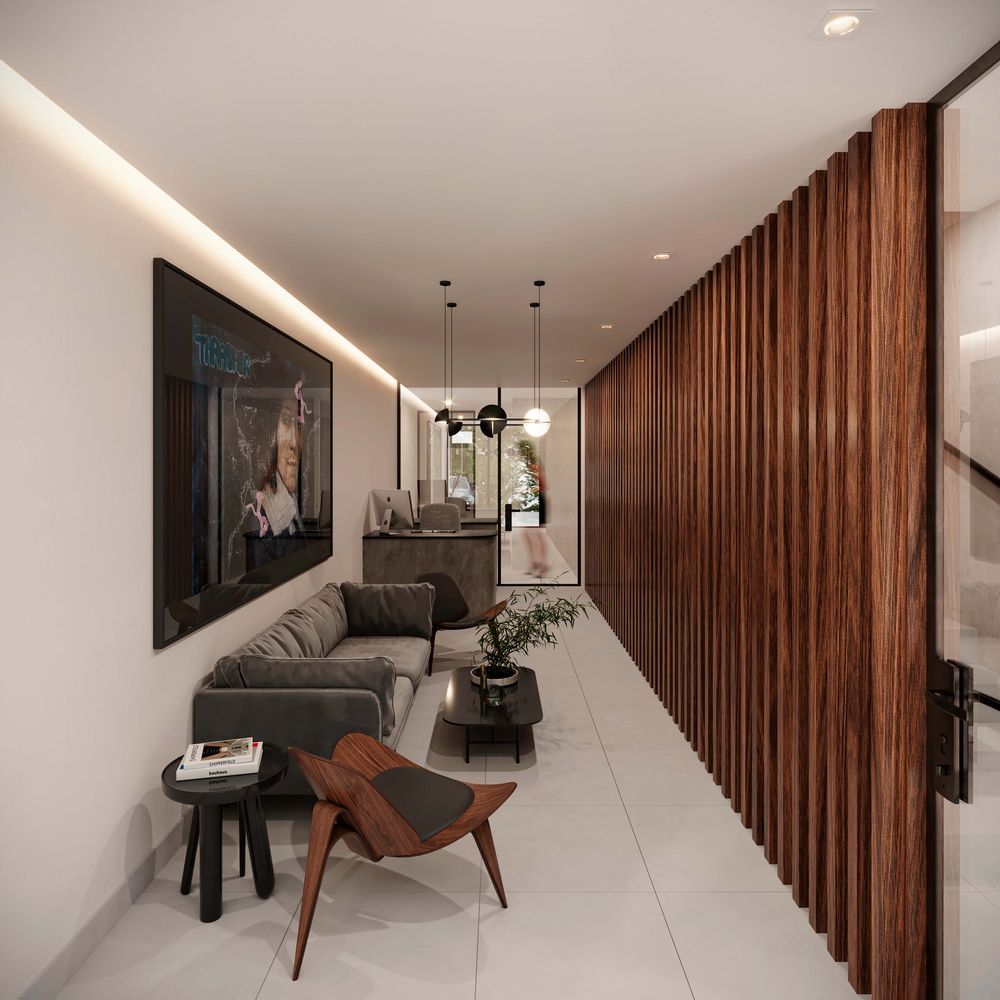 Recepción con muro de madera y sala de espera